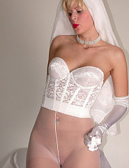 The bride before the wedding wears white pantyhose with no a panties